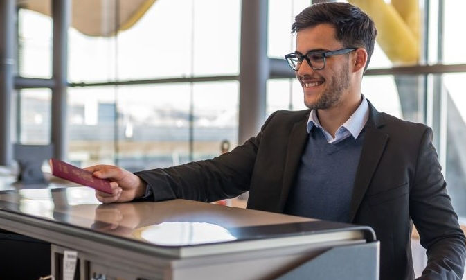 man at check in counter
