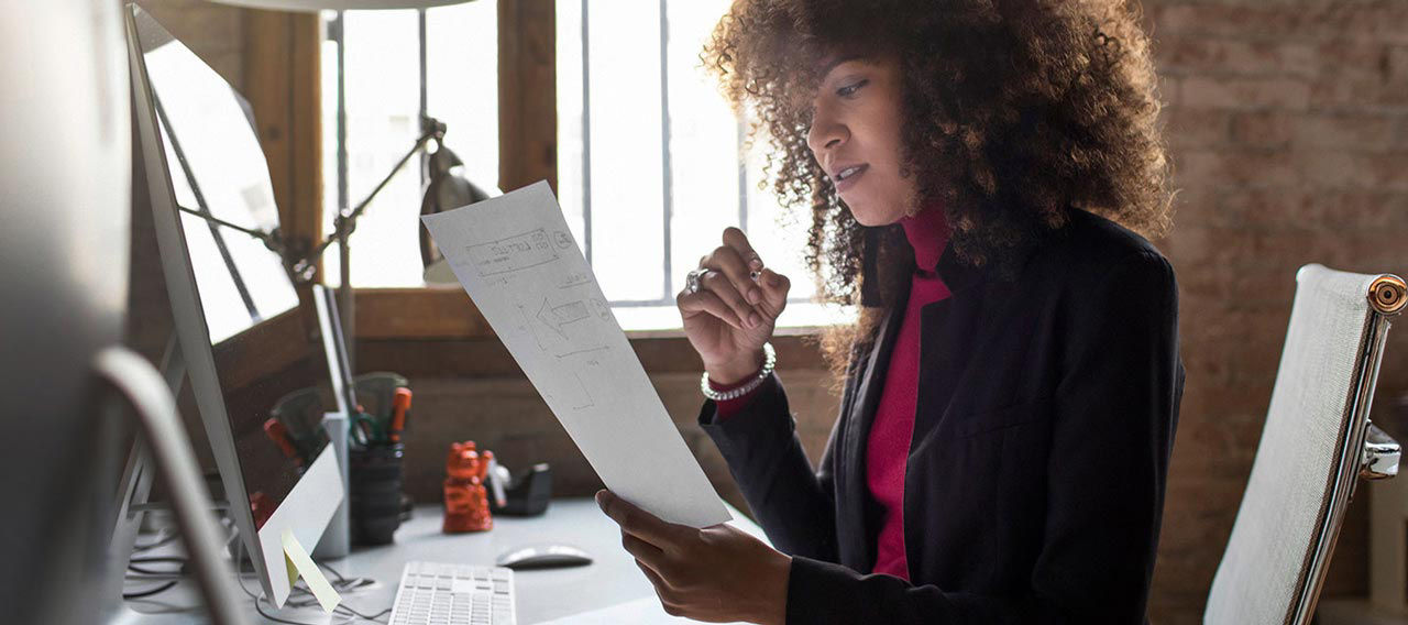 woman looking at docs