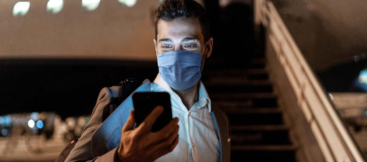 businessman in protective mask airport