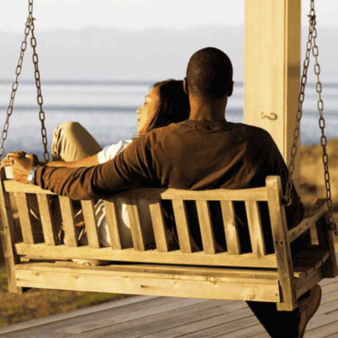 couple on swing cuddling