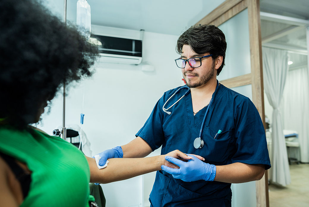 Medical professional treating a patient’s arm
