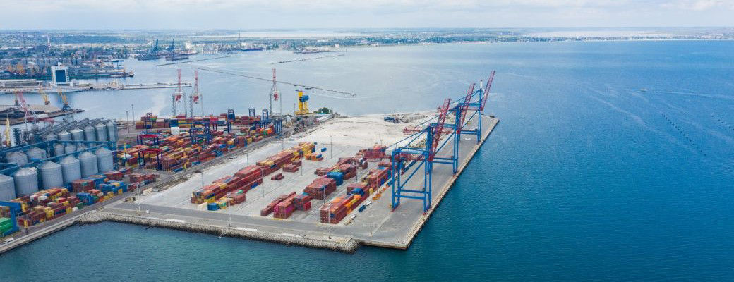 Aerial view of a busy container port illustrating supply chain risk for surety producers