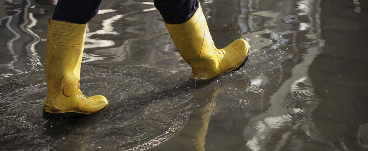 man walking in flood